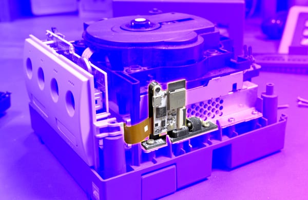 A partially disassembled GameCube with the FlippyDrive installed.